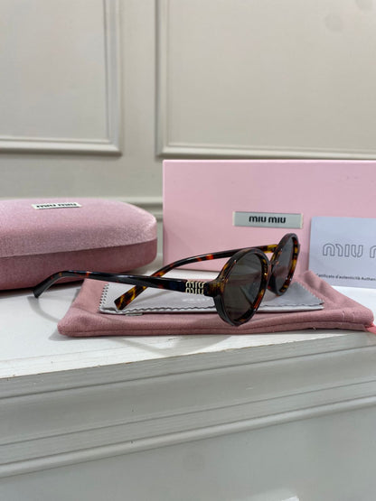 Lentes Miu Miu – Redondo pasta carey verde
