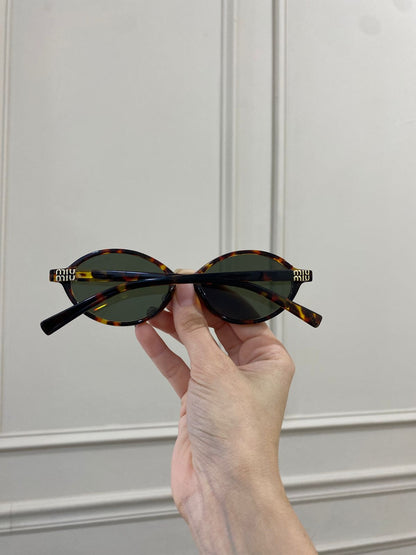 Lentes Miu Miu – Redondo pasta carey verde