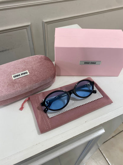Lentes Miu Miu – Redondo pasta Negro azul