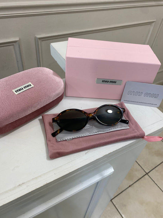Lentes Miu Miu – Redondo pasta carey verde