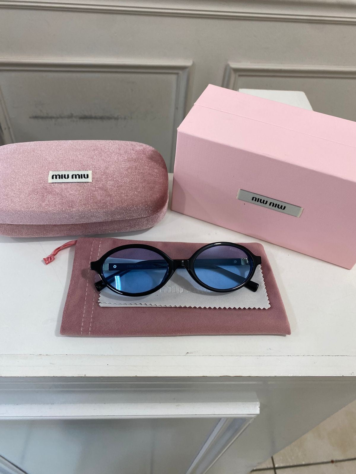 Lentes Miu Miu – Redondo pasta Negro azul