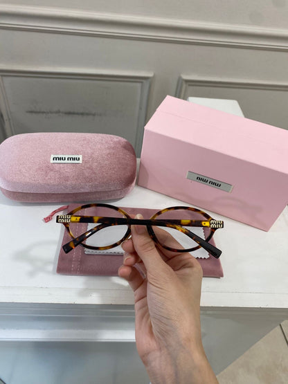 Lentes Miu Miu – Redondo pasta carey óptico