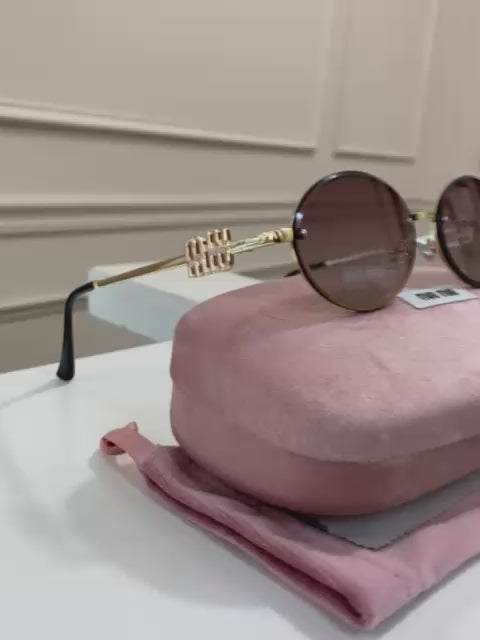 Lentes Miu Miu – Modelo Ovalado metal Rosa